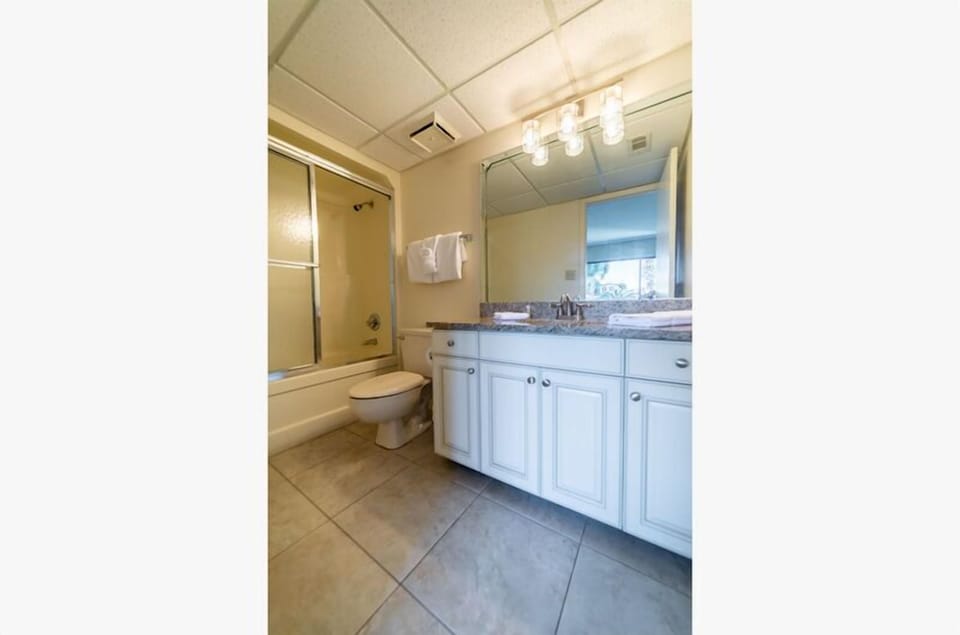 The Sea Life Third Bathroom has a single vanity and tub/shower combo