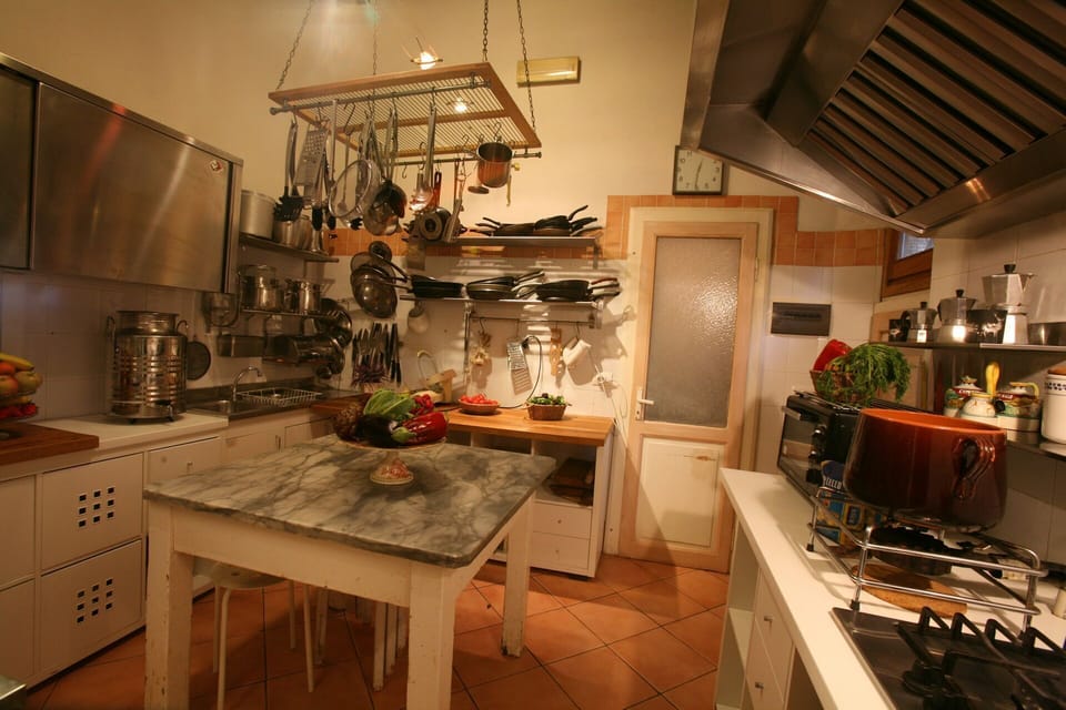 Countertop, Cabinetry, Table, Furniture, Kitchen, Kitchen Appliance, Lighting, Kitchen Stove, Wood, Interior Design