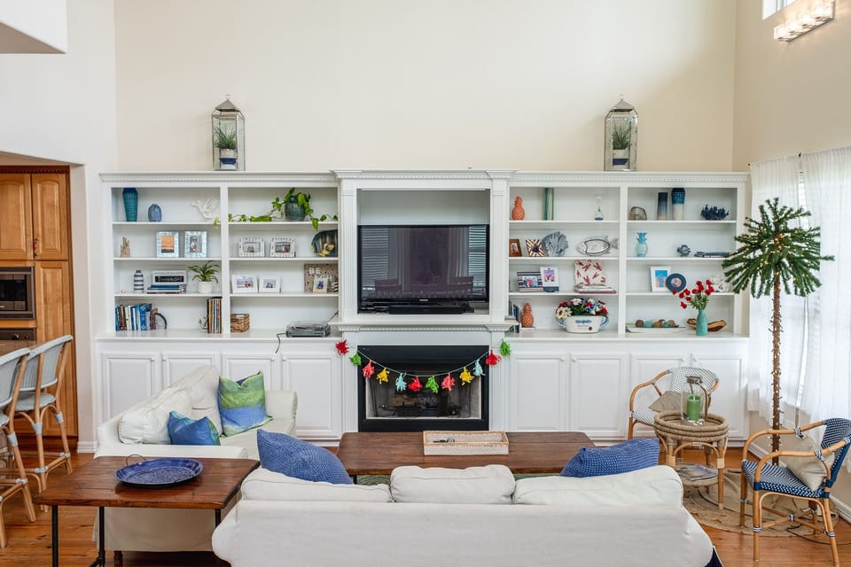 Plenty of seating for all to enjoy.  Books to read. Lighted palm, game cabinet.