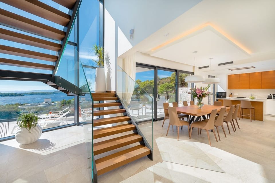 Inside of the luxurious villa Hvar Fantasy with the fully equipped kitchen and the open staircase with the view at the sea