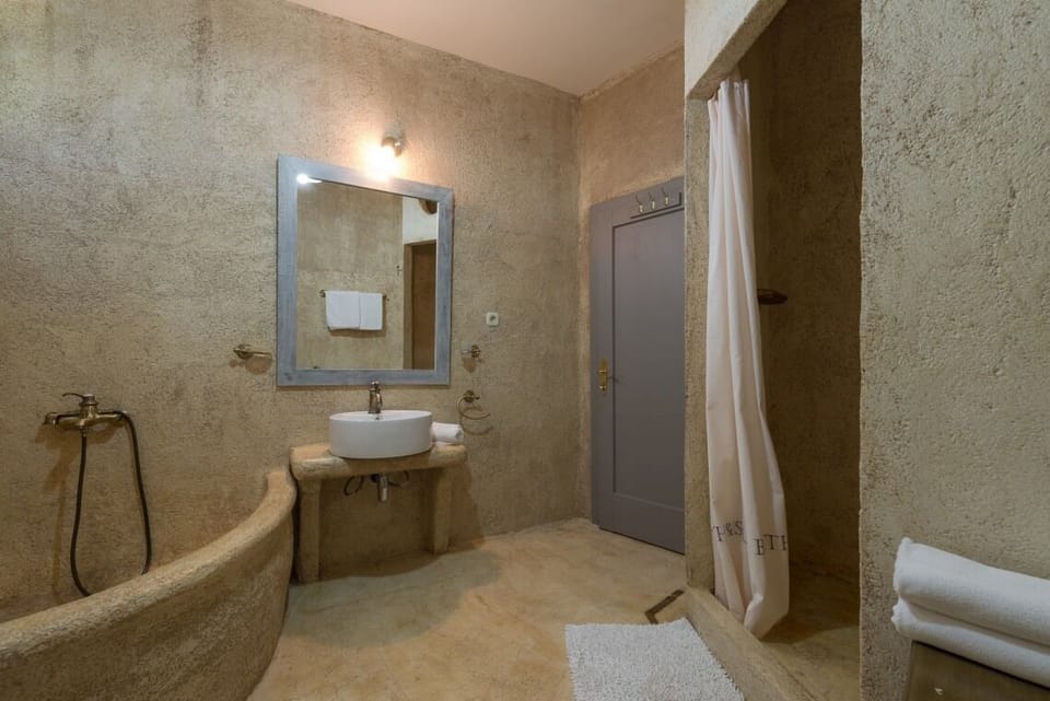 En suite bathroom with shower in Brač luxury beachfront villa Oasis with pool and parking.