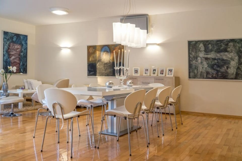 Chairs for 10 people around the dining table in the spacious living area on the ground floor of the modern villa with pool Primosten Oasis