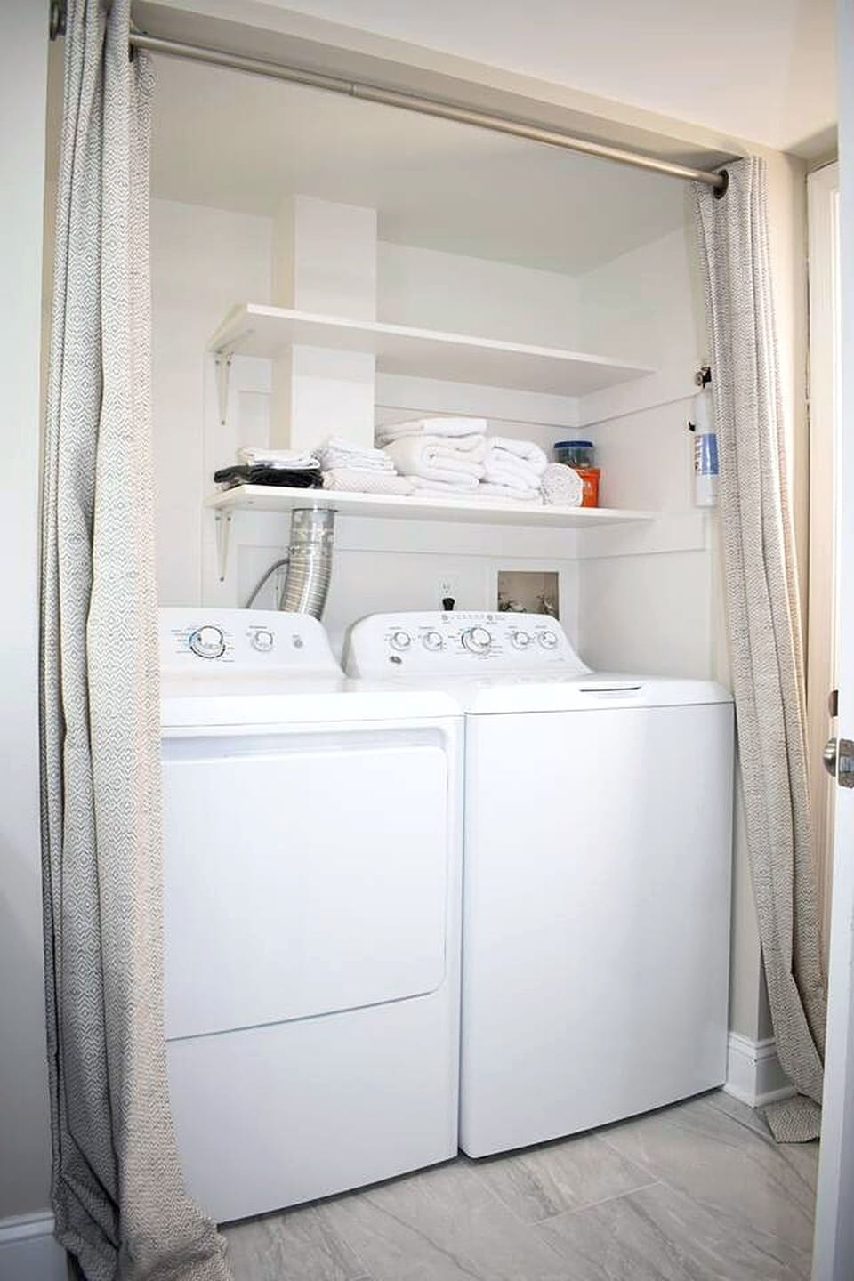 Laundry closet with washer, dryer and extra towels