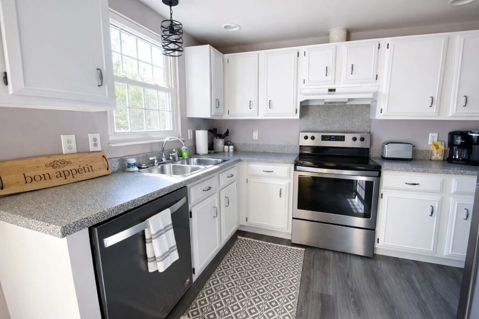 Fully Equipped Kitchen with Electric Range, Microwave and Stainless Steel Refrigerator