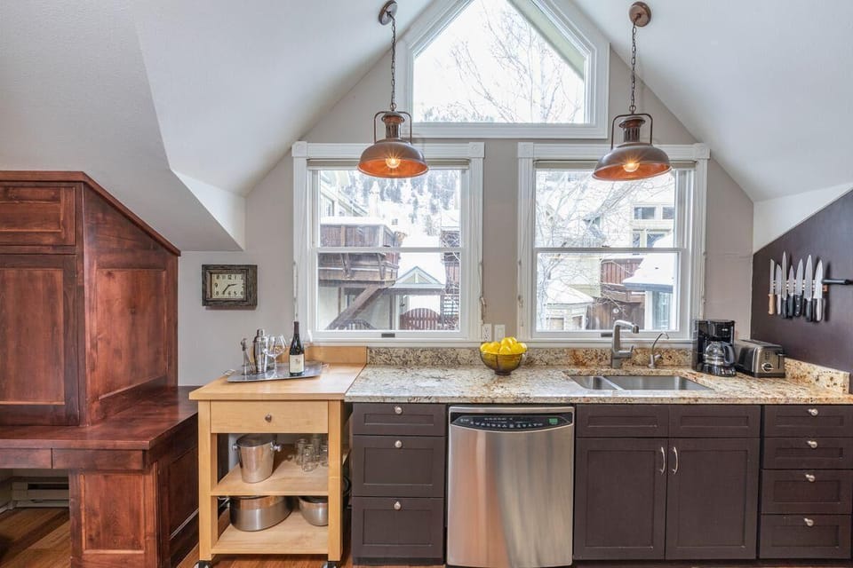 Savor the warm natural light streaming through the kitchen windows, creating a bright and welcoming atmosphere.