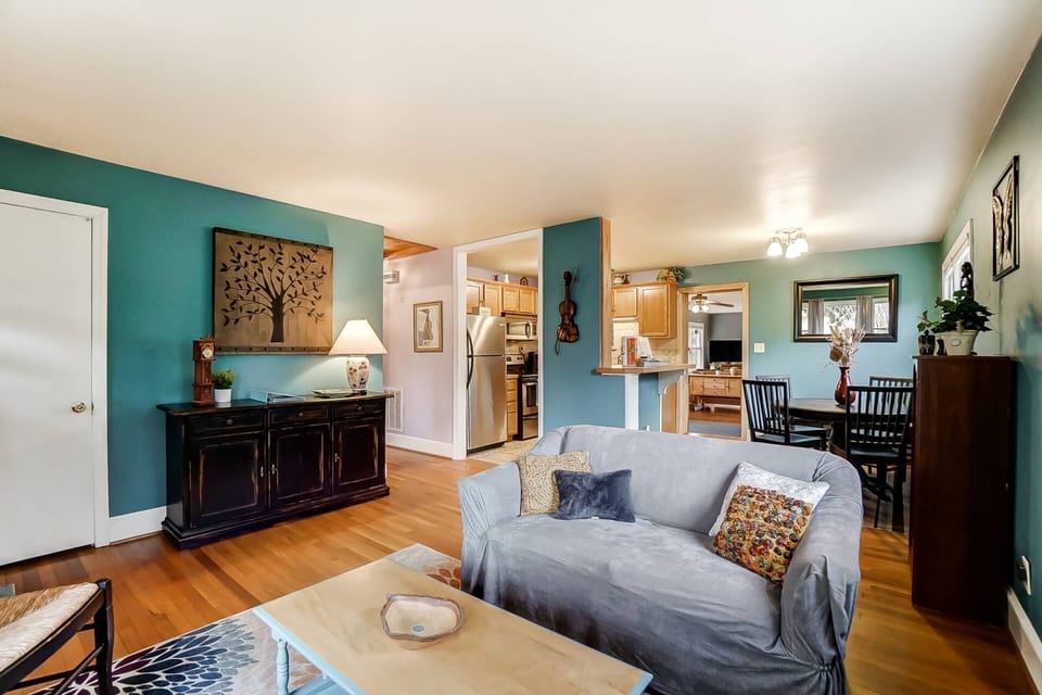 Living room is spacious with original hardwood floors.