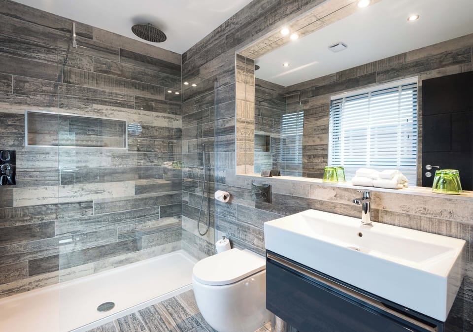 Woodland Superior Lodge | Bathroom | Designer toiletries, hair dryer, bathrobes, slippers