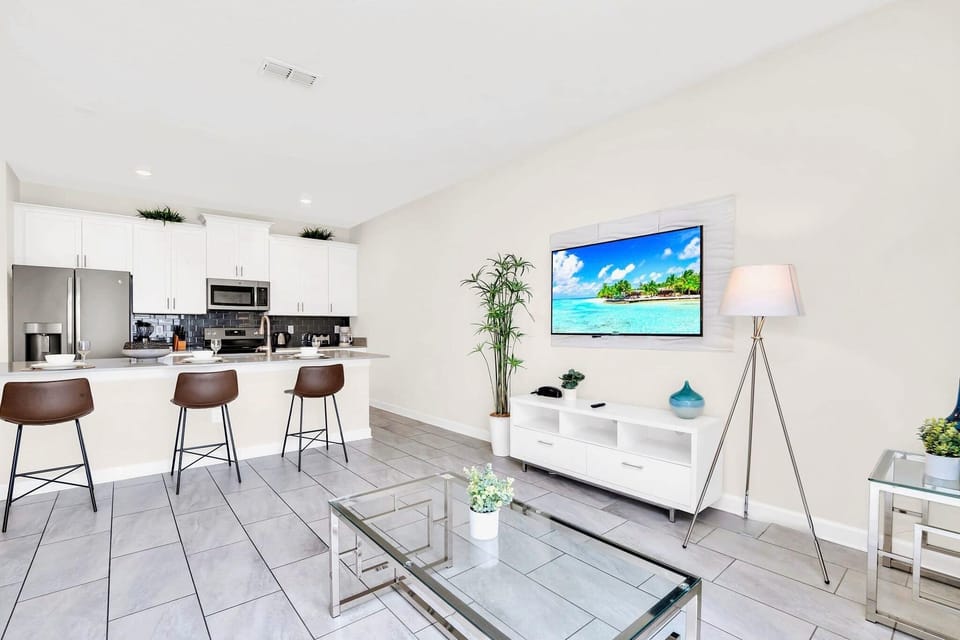 Open-Concept Living Room With A Smart TV And Modern Decor