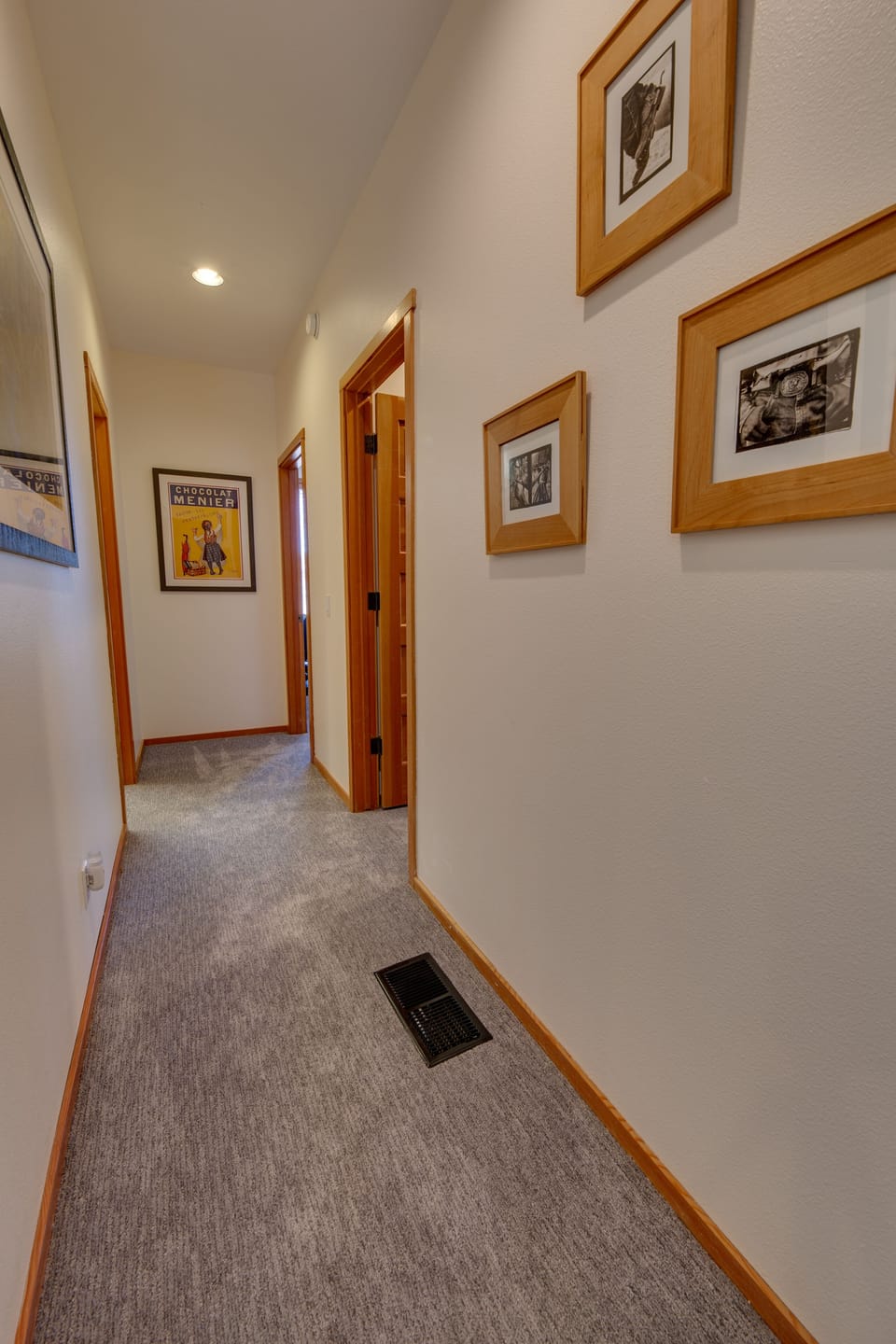 Downstairs hallway leads to bunks and twin bedrooms.