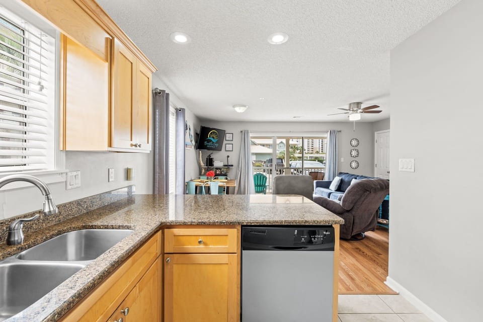 Open to the living area. Dishwasher.