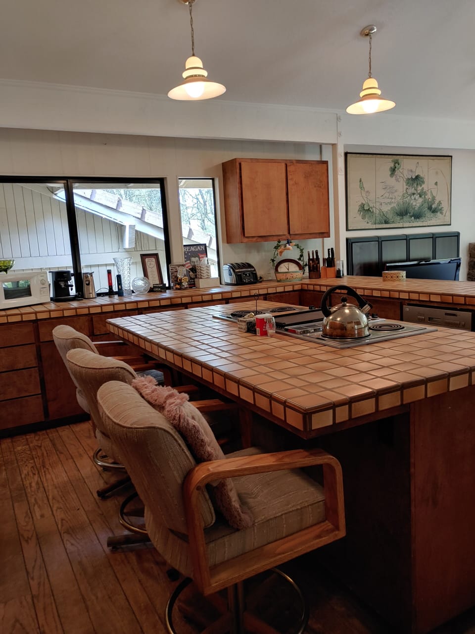 Kitchen with grill coffee pot toaster fridge ovens microwave