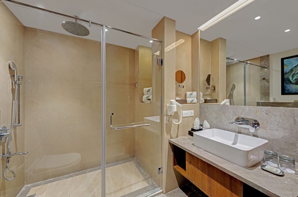 Winter Green Room King Bed | Bathroom | Eco-friendly toiletries, hair dryer, bathrobes, slippers