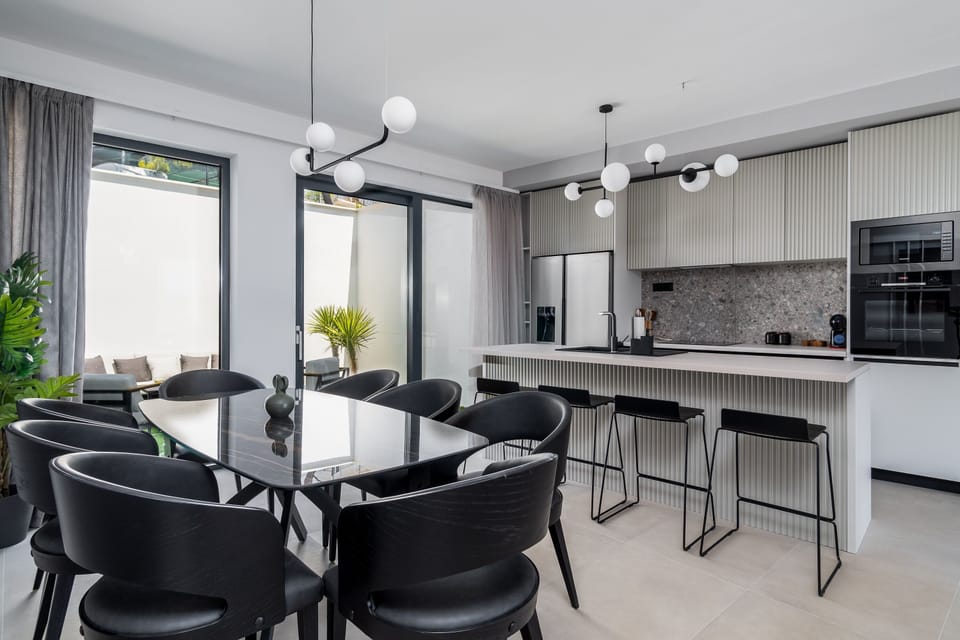 A fully equipped kitchen with a kitchen island