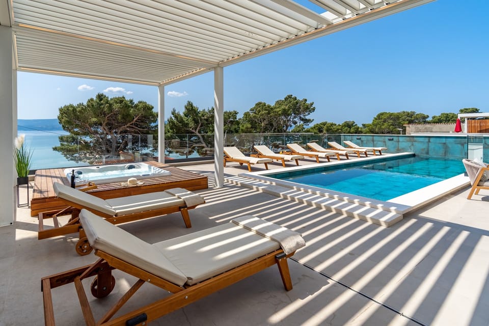 The outdoor area also offers: a 33 sqm Heated private pool, a Jacuzzi