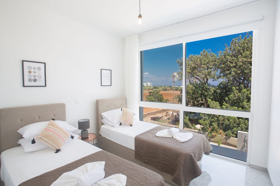 Bedroom 4 with two single beds and widescreen TV