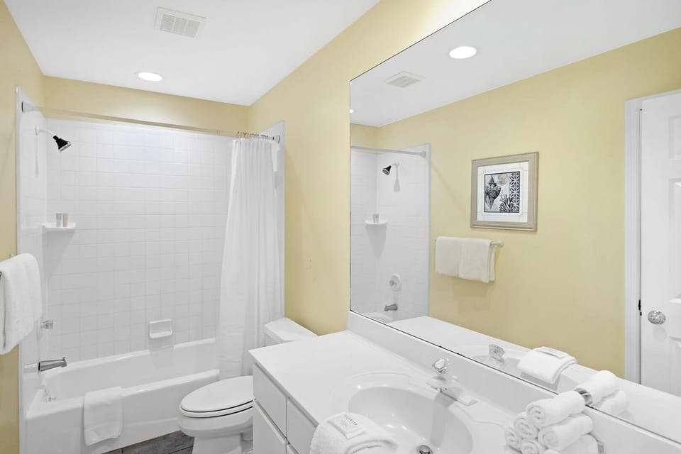 Full bathroom located in the hallway upstairs