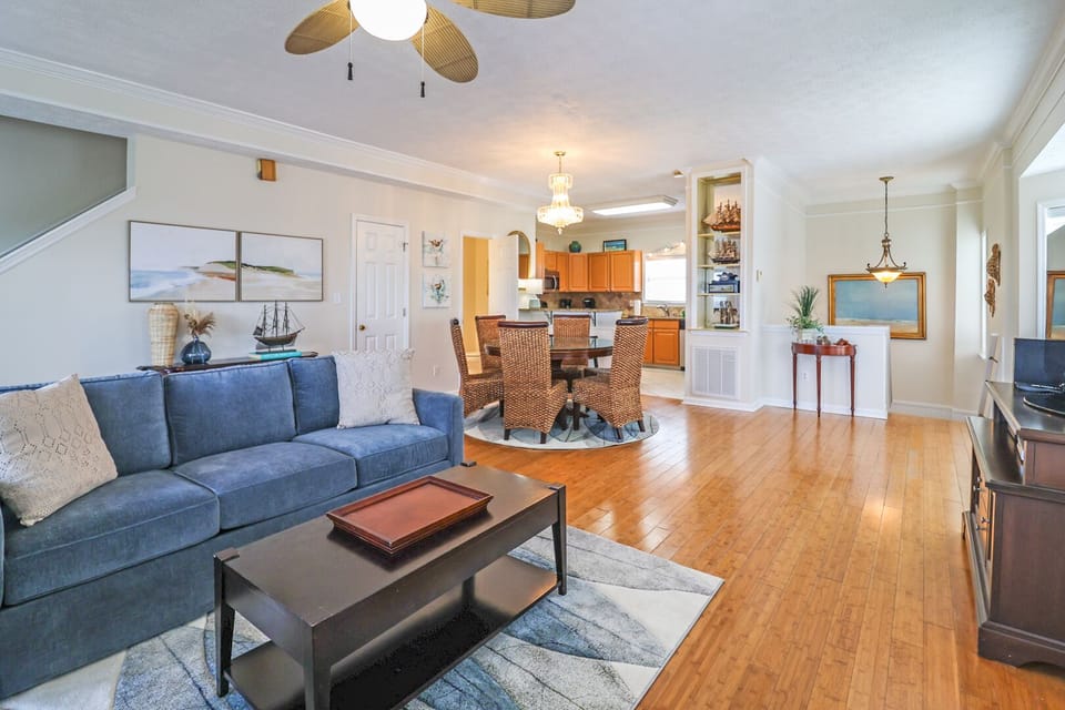Open floor plan showing the living room, dining area, and kitchen on the middle floor