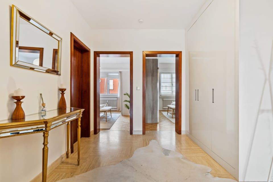Inviting entrance hallway featuring stylish furnishings and a warm, welcoming atmosphere.