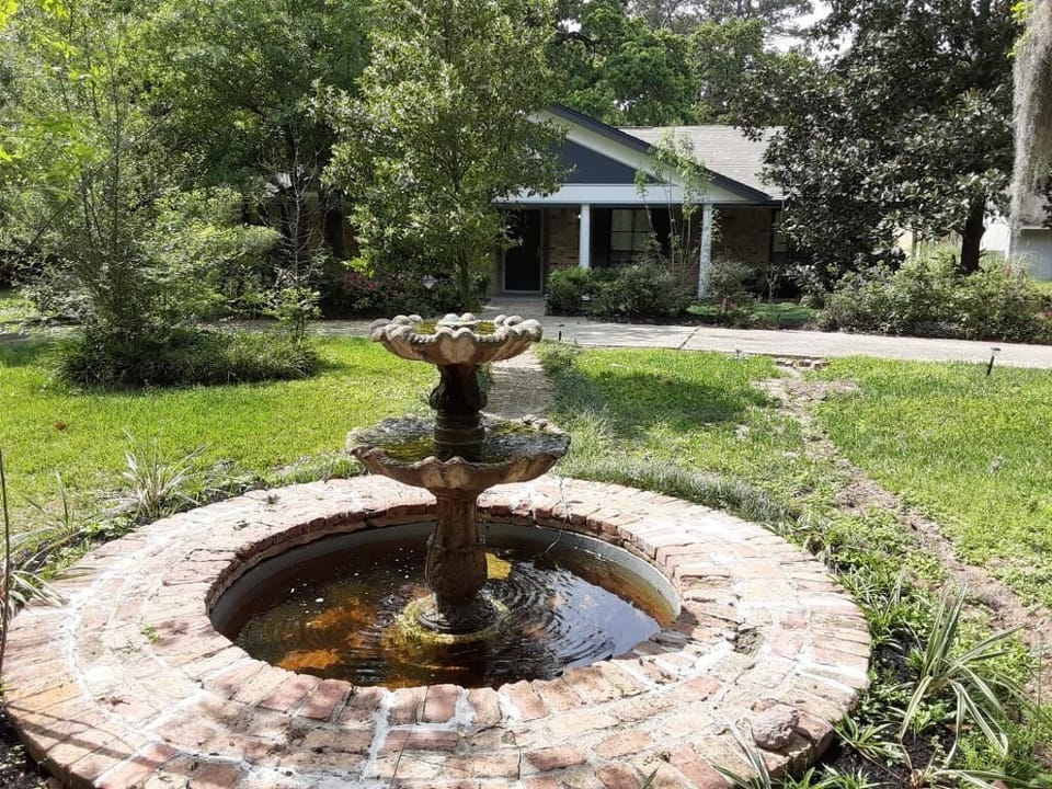 Enjoy the sound of water from this fountain while sitting on the porch.