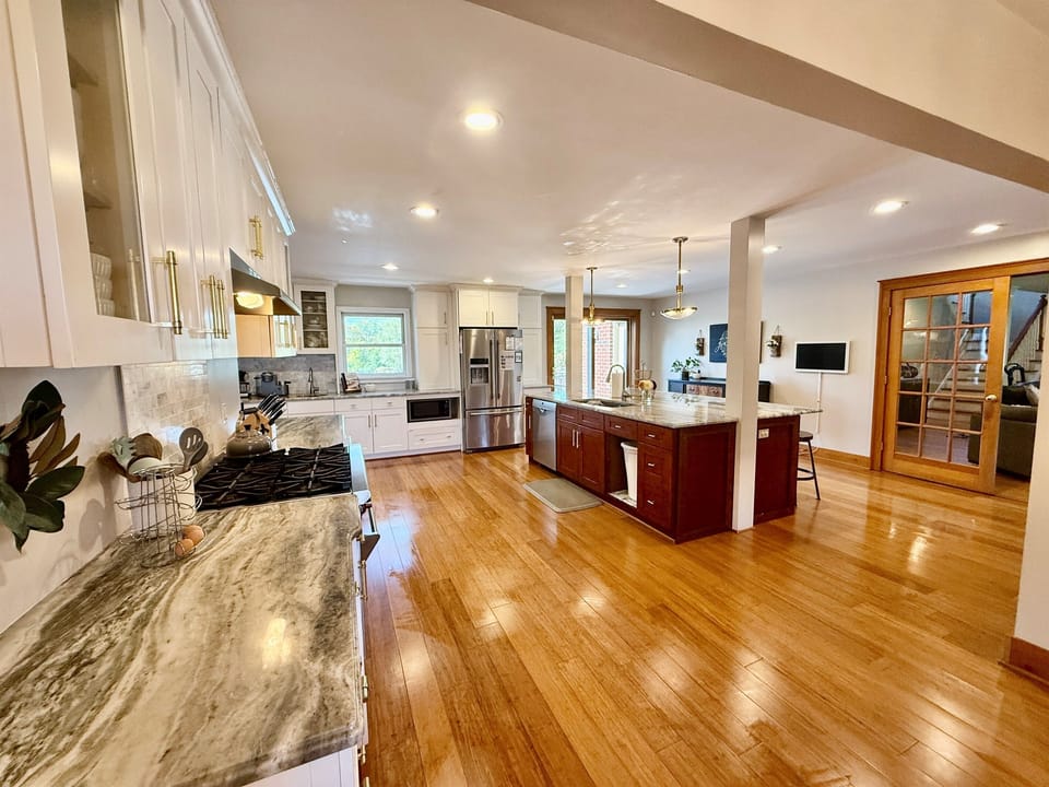 Chef's Kitchen! Huge Island, Beverage Center, Wolf Range and Butlers Kitchen with 2 additional ovens.