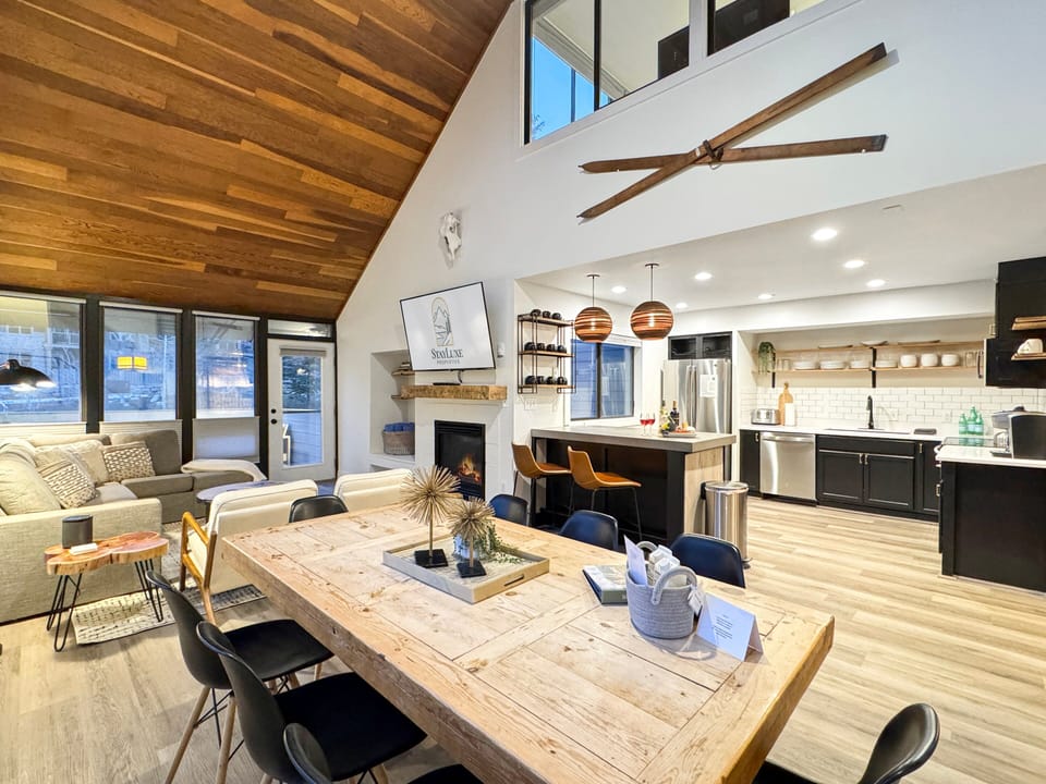 The dining area is conveniently located next to the kitchen, making it easy to prepare and serve meals.