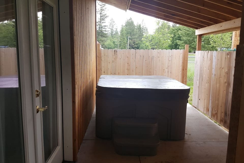 Hot tub/small fenced back yard