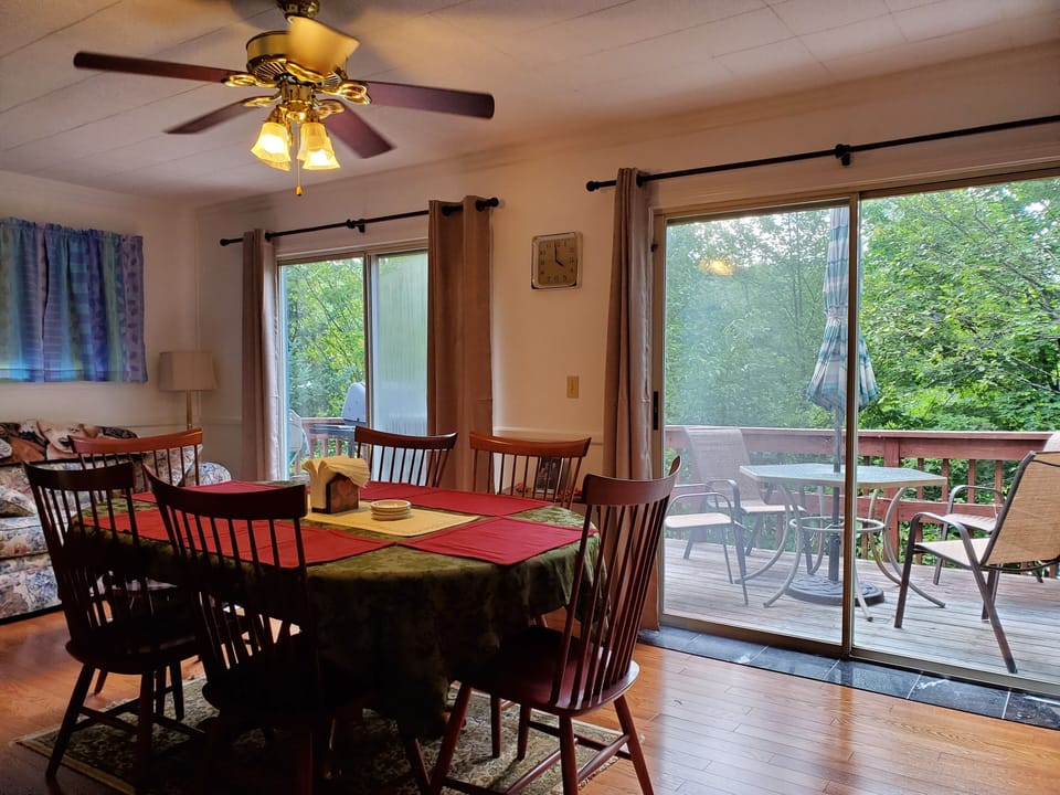 Dinning room with lake views, and patio furniture seating area.