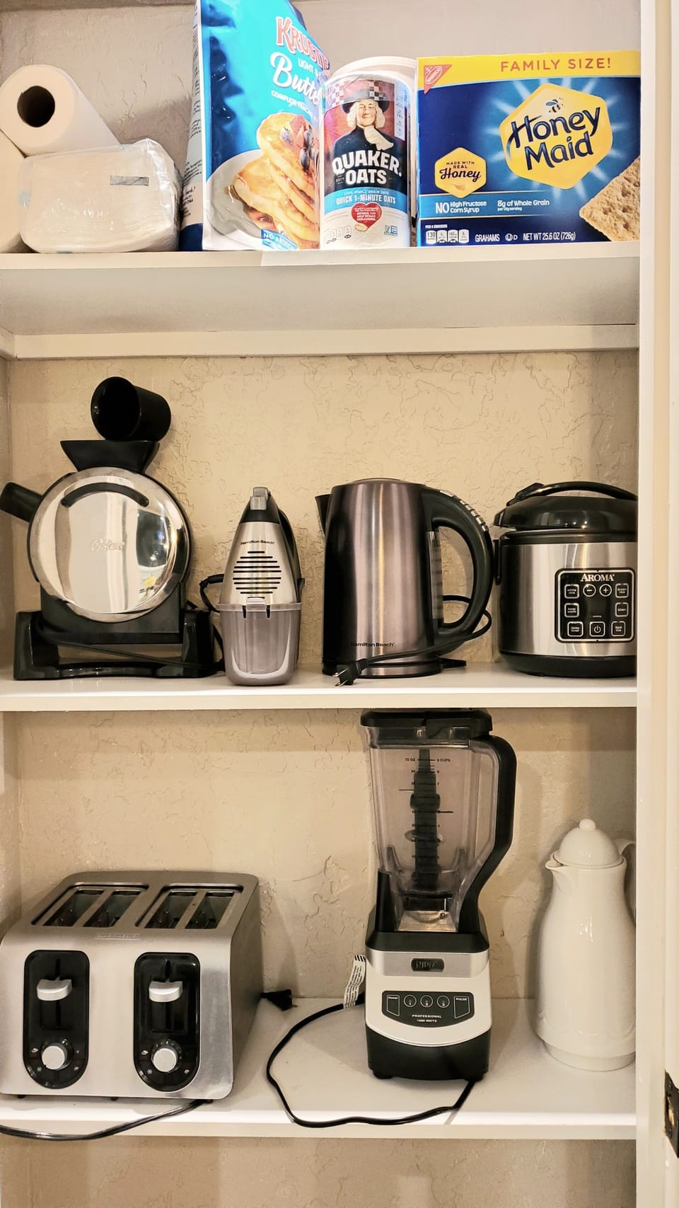 Pantry with kettle, blender, rice cooker, toaster and waffle maker