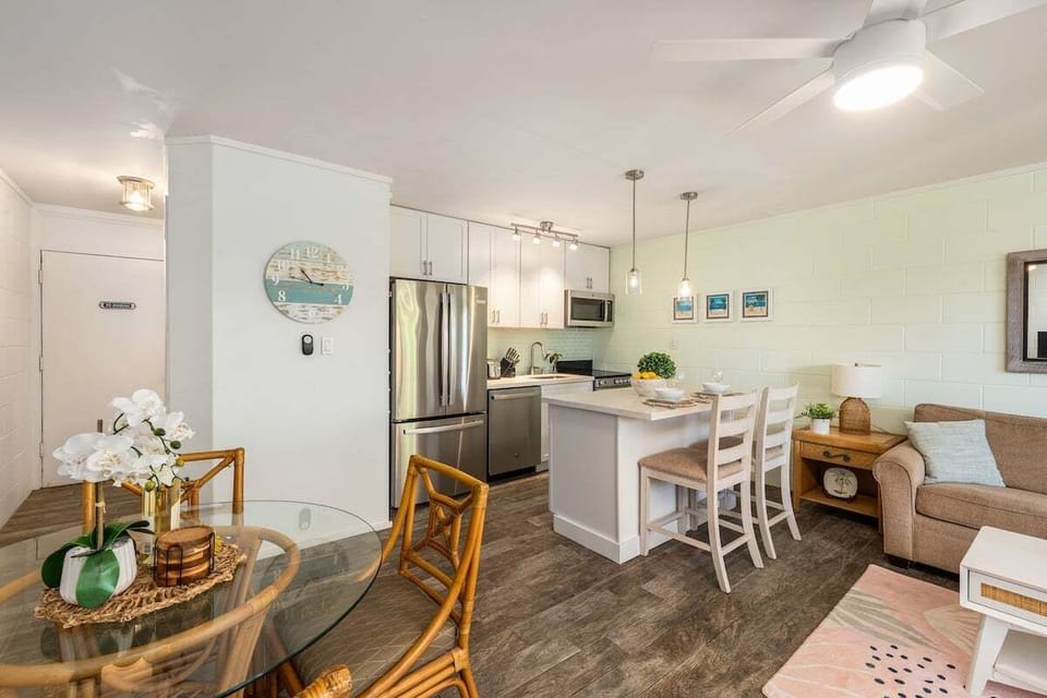 Charming living and dining area with woven accents, soft lighting, and a warm, inviting atmosphere throughout.