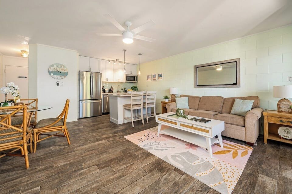 Open living area with modern furnishings, rattan textures, and a spacious layout designed for relaxed island comfort.

Please note: the sofa bed, armchair, and coffee table have been recently replaced.
