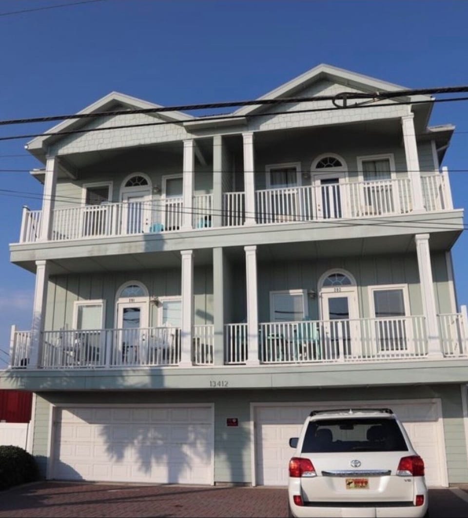 Front Beach Rd view of Condo Building.  #302 is the top right in this photo. 