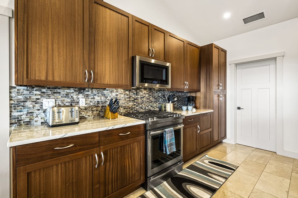 Kitchen with oven and microwave.