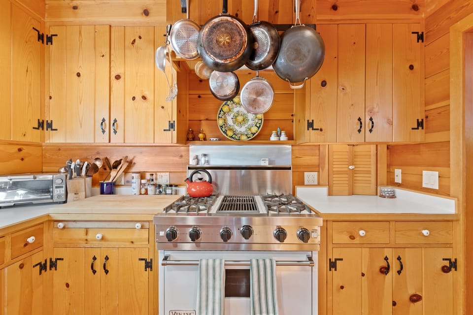Kitchen includes a Viking gas range and large convection oven