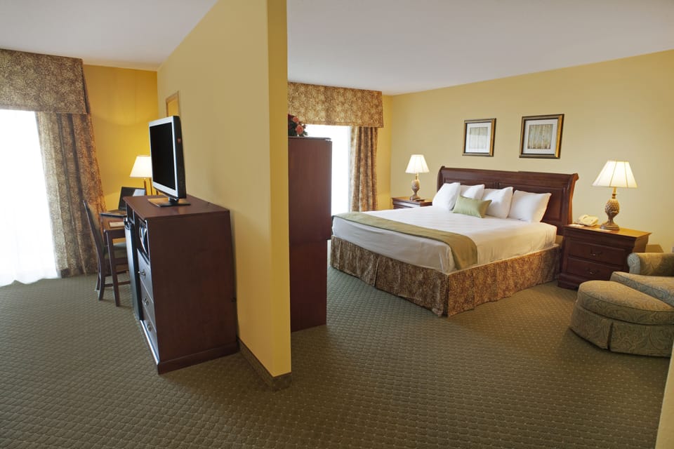 Suite, 1 King Bed with Sofa bed, Non Smoking | Living area | 32-inch flat-screen TV with cable channels, TV