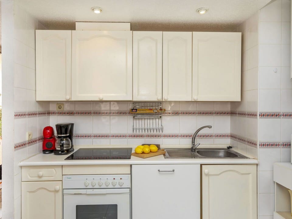 Kitchen, Countertop, Kitchen Appliance, Major Appliance, Cabinetry, Sink, Interior Design, Flooring, Plumbing Fixture, Tap