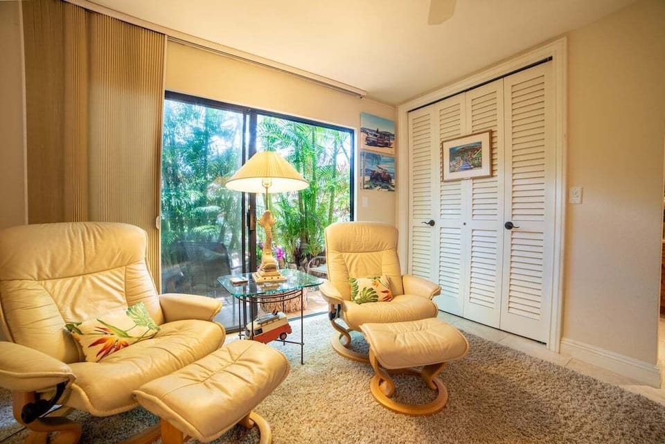 Relax in sitting areas bright with recliners and sliding doors.