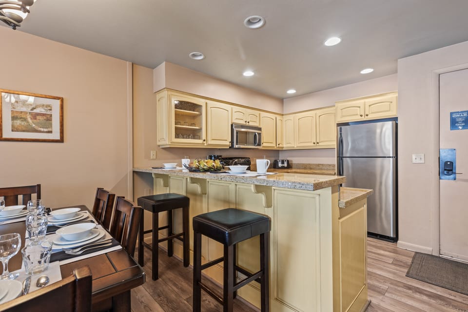 Premier Snow Flower Condominium 107's countertop seating for 2, and open concept kitchen.