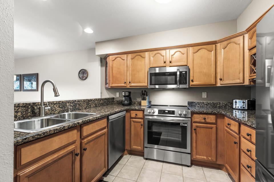 The well-equipped kitchen with stainless steel appliances.