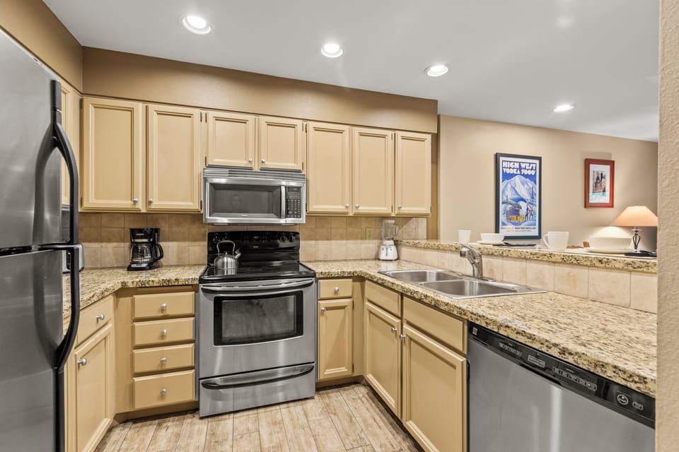 Snow Flower 144 has a well-equipped kitchen with stainless steel appliances.