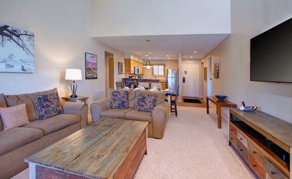 The living room has a comfortable couch and loveseat.