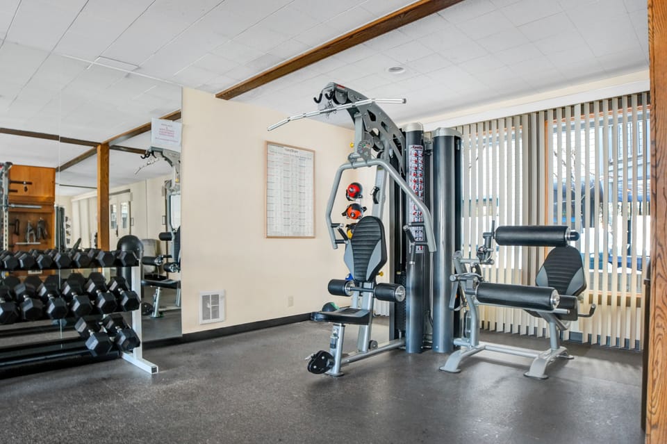 Fitness Room includes various machines and free weights.