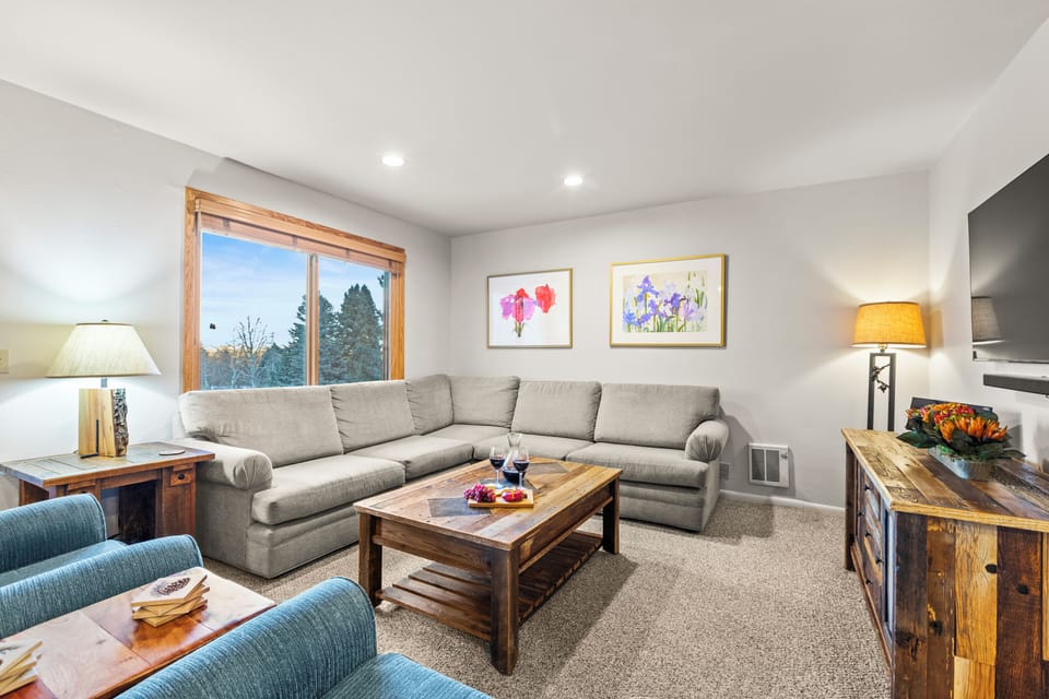 Snowflower 41 offers a spacious living area with a large sectional sofa.