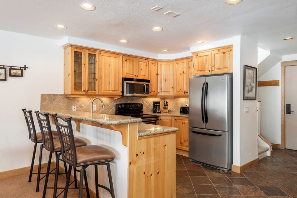 Snow Flower 74 offers stainless steel appliances in the open concept kitchen.