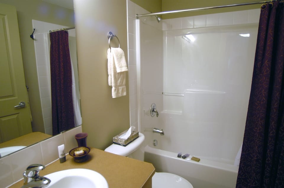 Second bathroom, with shower over tub.