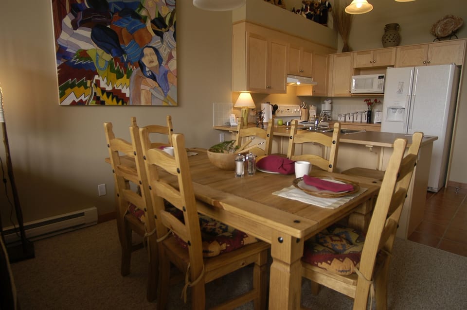Dining and bar area with unique native artwork.