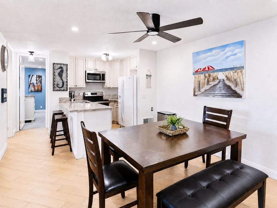 Kitchen and dining for six with stainless-steel appliances and Keurig coffee maker