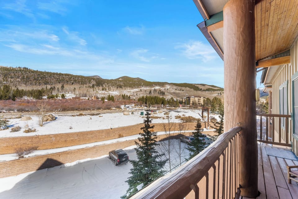 Mountain views stretch across snow-covered landscape from this private balcony, perfect for morning coffee with alpine scenery.