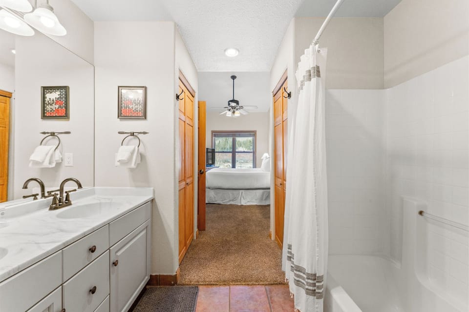 Your private bathroom features a spacious shower, vanity with ample storage, and connects directly to your cozy bedroom.