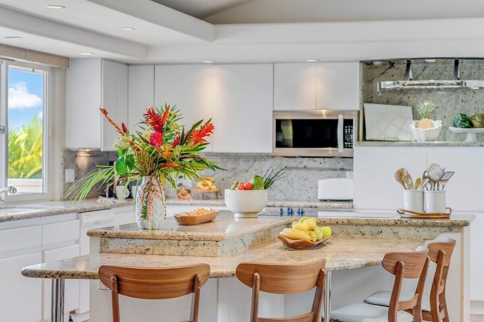 Enjoy a fully equipped kitchen with a stylish island perfect for casual dining or entertaining