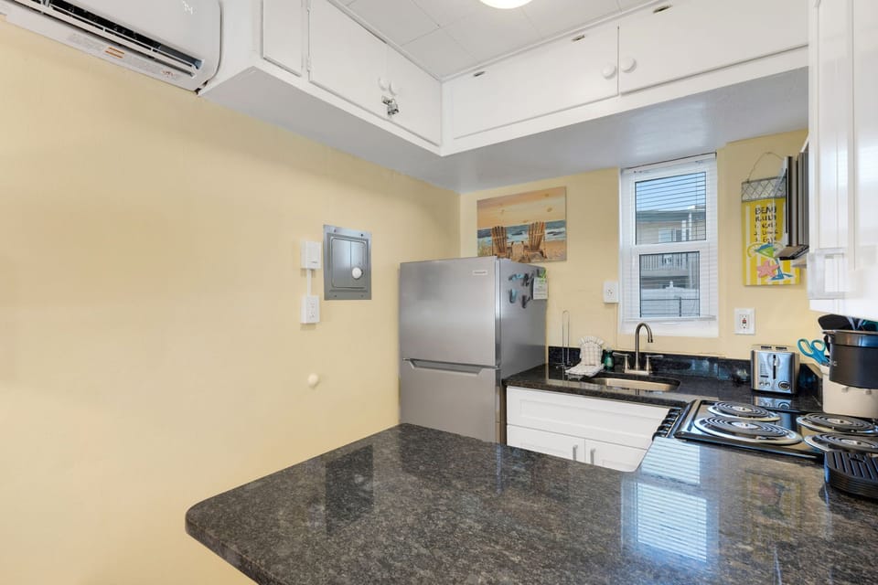 The kitchen is equipped with basics for convenience. It Includes a refrigerator, stove/oven, microwave, toaster and a Keurig & regular drip coffee maker